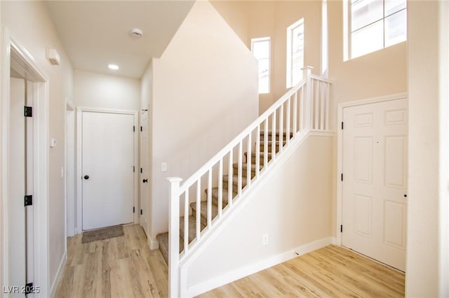 6387 Azurelyn Ave, Las Vegas, NV 89122 - staircase with wood finished floors and baseboards