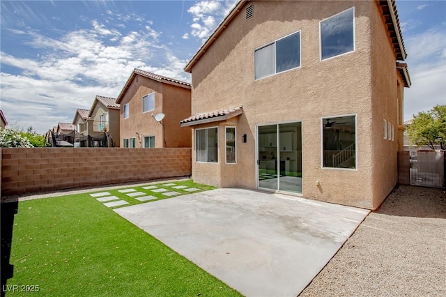 6387 Azurelyn Ave, Las Vegas, NV 89122 - rear view of house featuring stucco siding and a patio