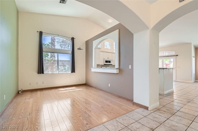 2889 Anteres St, Las Vegas, NV 89117 - foyer featuring light wood finished floors, arched walkways, and baseboards