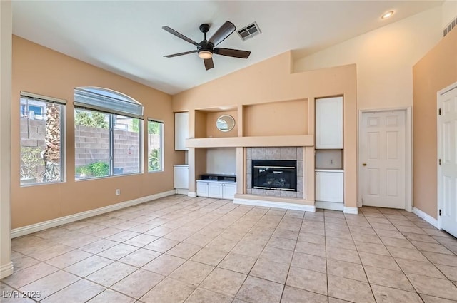 2889 Anteres St, Las Vegas, NV 89117 - unfurnished living room with light tile patterned flooring, a ceiling fan, lofted ceiling, baseboards, and a tiled fireplace
