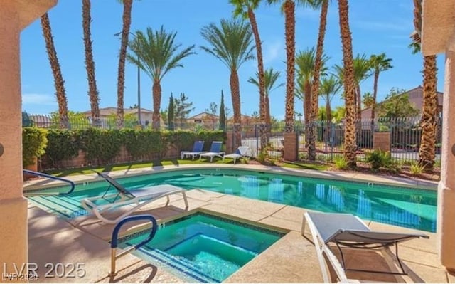 2889 Anteres St, Las Vegas, NV 89117 - community pool with an in-ground hot tub, a fenced backyard, and a patio