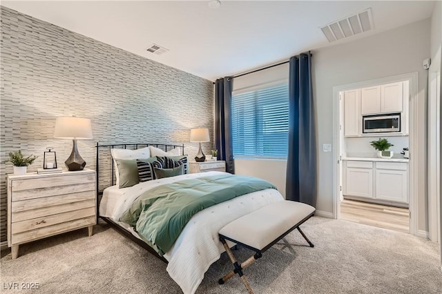 9564 Archer Peak Ct, Las Vegas, NV 89143 - bedroom with light colored carpet, baseboards, and an accent wall