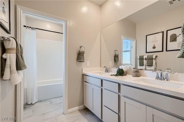 9564 Archer Peak Ct, Las Vegas, NV 89143 - full bath featuring double vanity, baseboards, and shower / tub combo
