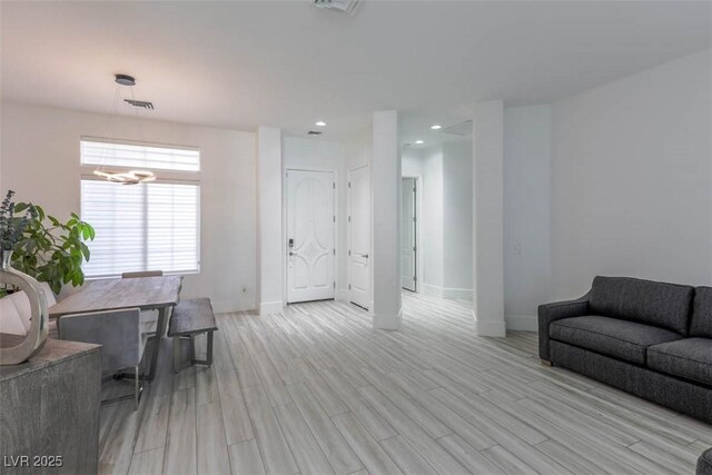 271 E Shelbourne Ave, Las Vegas, NV 89123 - living area with light wood-style flooring, a chandelier, baseboards, and recessed lighting
