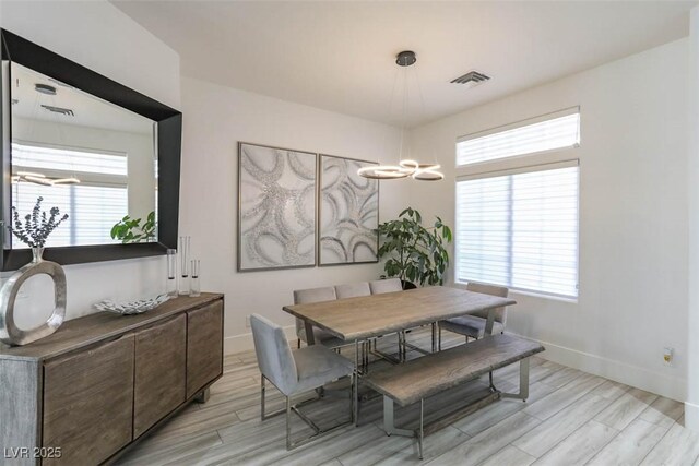 271 E Shelbourne Ave, Las Vegas, NV 89123 - dining room with light wood-style flooring, plenty of natural light, and baseboards