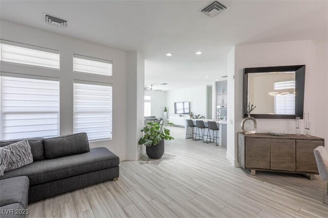 271 E Shelbourne Ave, Las Vegas, NV 89123 - living room featuring wood finished floors, baseboards, and recessed lighting