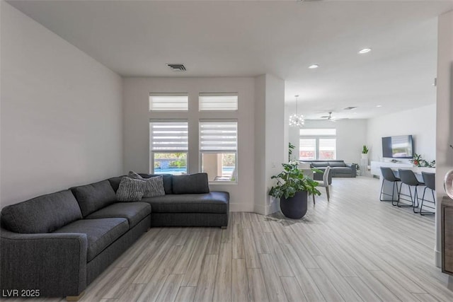 271 E Shelbourne Ave, Las Vegas, NV 89123 - living room with light wood finished floors, recessed lighting, and baseboards