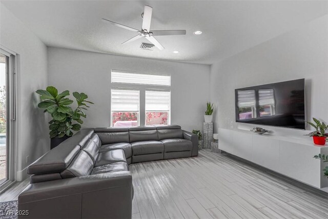 271 E Shelbourne Ave, Las Vegas, NV 89123 - living room with plenty of natural light, wood finished floors, and a ceiling fan