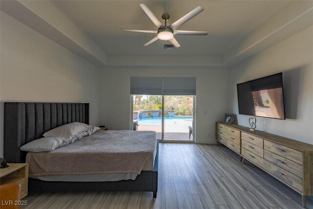271 E Shelbourne Ave, Las Vegas, NV 89123 - bedroom with a raised ceiling, access to outside, wood finished floors, and a ceiling fan