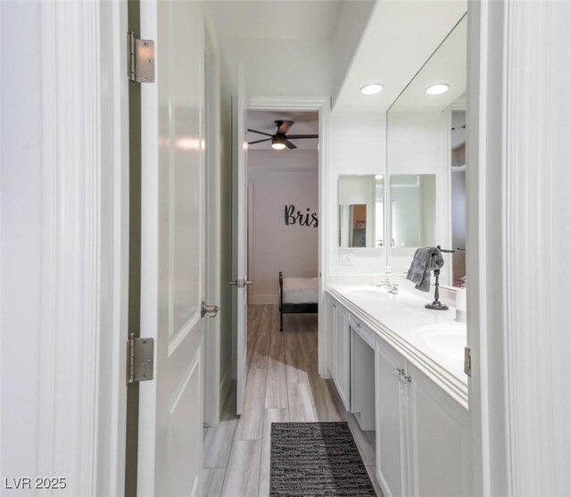 271 E Shelbourne Ave, Las Vegas, NV 89123 - full bathroom featuring double vanity, ceiling fan, recessed lighting, wood finished floors, and ensuite bath