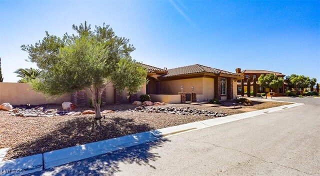 271 E Shelbourne Ave, Las Vegas, NV 89123 - view of front of property featuring stucco siding and a tiled roof