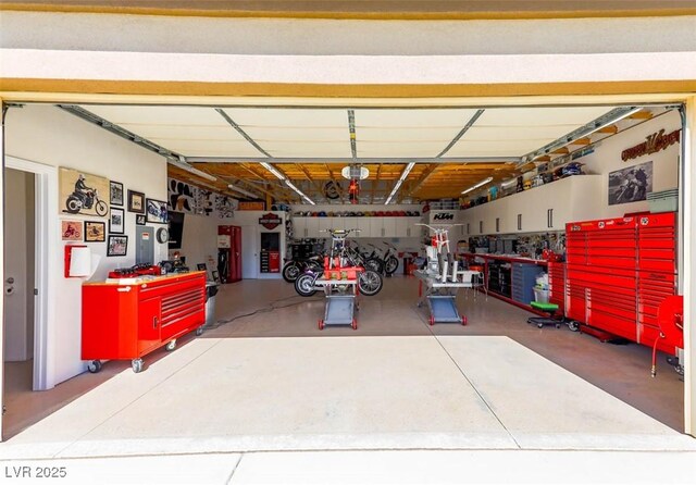 271 E Shelbourne Ave, Las Vegas, NV 89123 - garage featuring a garage door opener and a workshop area