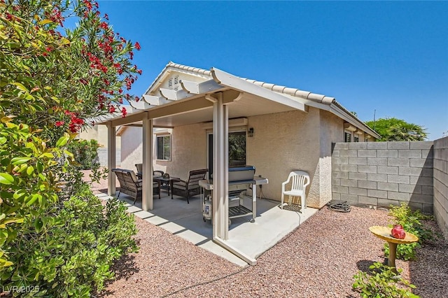 3629 Ferrell St, North Las Vegas, NV 89032 - rear view of house with stucco siding, an outdoor hangout area, a patio area, and a tile roof