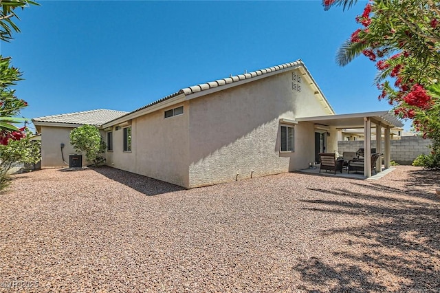 3629 Ferrell St, North Las Vegas, NV 89032 - back of house with stucco siding, a patio area, and central AC