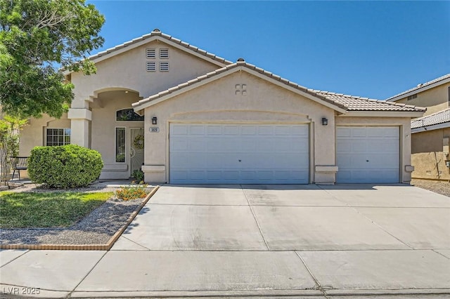 3629 Ferrell St, North Las Vegas, NV 89032 - mediterranean / spanish-style home with stucco siding, driveway, and an attached garage
