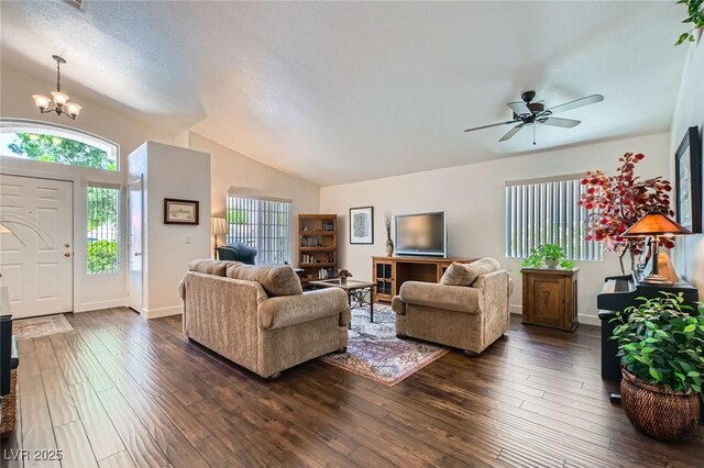 3629 Ferrell St, North Las Vegas, NV 89032 - living area with vaulted ceiling, dark wood-style floors, a chandelier, and ceiling fan