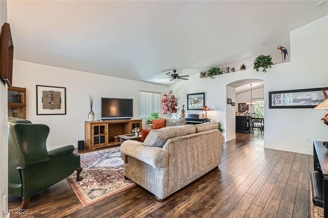3629 Ferrell St, North Las Vegas, NV 89032 - living room featuring dark wood-type flooring, a ceiling fan, arched walkways, and baseboards