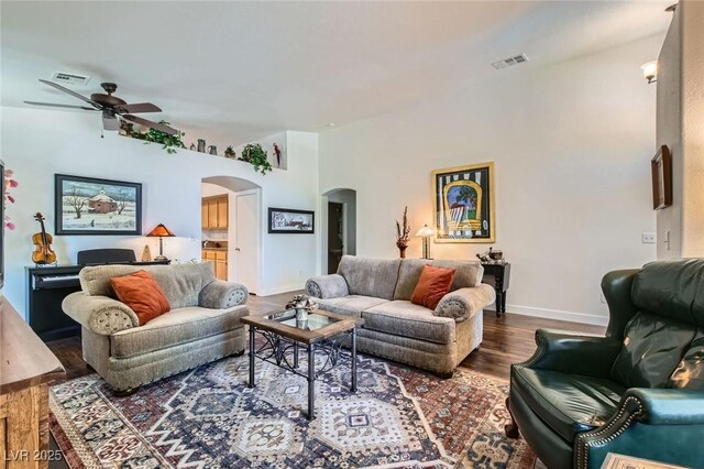 3629 Ferrell St, North Las Vegas, NV 89032 - living area featuring arched walkways, ceiling fan, wood finished floors, and baseboards