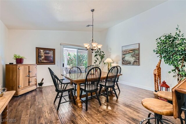 3629 Ferrell St, North Las Vegas, NV 89032 - dining space featuring a chandelier, baseboards, dark wood-style flooring, and lofted ceiling