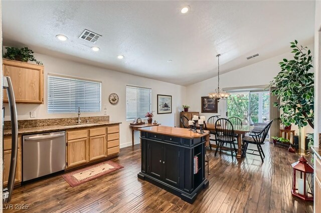 3629 Ferrell St, North Las Vegas, NV 89032 - kitchen featuring dishwasher, a sink, light brown cabinetry, vaulted ceiling, and recessed lighting
