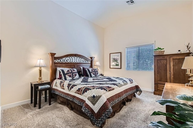 3629 Ferrell St, North Las Vegas, NV 89032 - bedroom featuring light carpet, vaulted ceiling, and baseboards