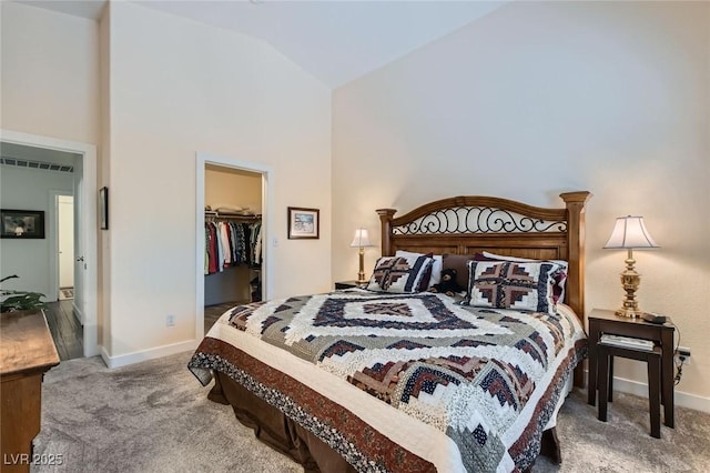 3629 Ferrell St, North Las Vegas, NV 89032 - bedroom featuring carpet flooring, a spacious closet, baseboards, high vaulted ceiling, and a closet