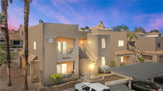 2200 Highpointe Dr Unit 202, Laughlin, NV 89029 - back of property at dusk with stucco siding