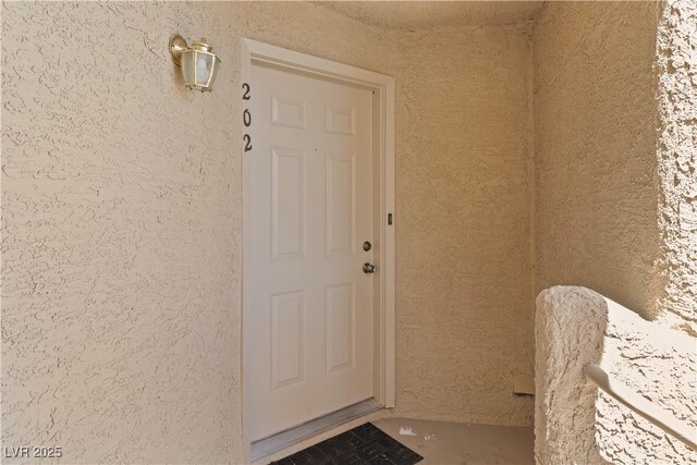 2200 Highpointe Dr Unit 202, Laughlin, NV 89029 - doorway to property with stucco siding