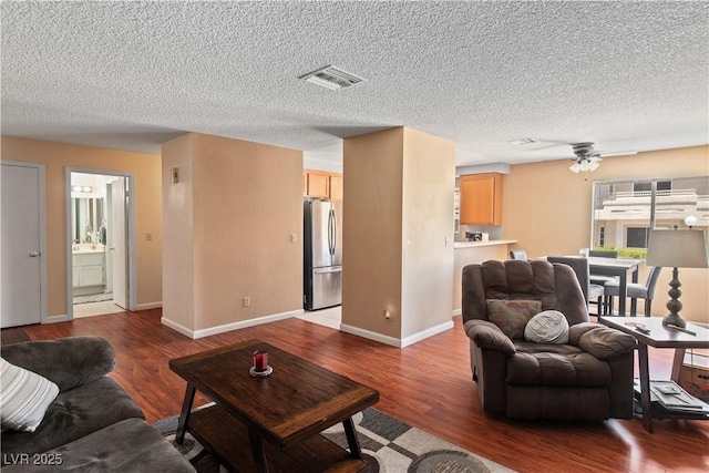 2200 Highpointe Dr Unit 202, Laughlin, NV 89029 - living room with wood finished floors, ceiling fan, a textured ceiling, and baseboards