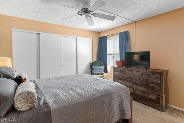 2200 Highpointe Dr Unit 202, Laughlin, NV 89029 - bedroom with carpet floors, a closet, ceiling fan, and a textured ceiling