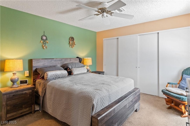 2200 Highpointe Dr Unit 202, Laughlin, NV 89029 - carpeted bedroom featuring a closet, ceiling fan, and a textured ceiling