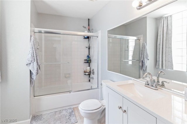 2200 Highpointe Dr Unit 202, Laughlin, NV 89029 - bathroom featuring vanity, bath / shower combo with glass door, and toilet