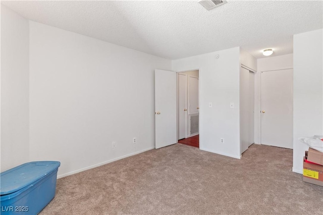 2200 Highpointe Dr Unit 202, Laughlin, NV 89029 - unfurnished bedroom with carpet floors, a textured ceiling, and baseboards