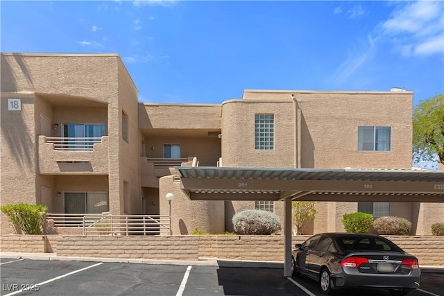 2200 Highpointe Dr Unit 202, Laughlin, NV 89029 - view of property featuring covered and uncovered parking