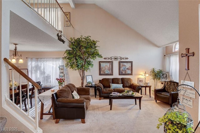7109 Deepriver Cir, Las Vegas, NV 89129 - carpeted living room with high vaulted ceiling, healthy amount of natural light, stairway, and a chandelier