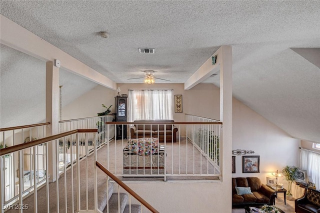7109 Deepriver Cir, Las Vegas, NV 89129 - stairs featuring a textured ceiling, healthy amount of natural light, and ceiling fan