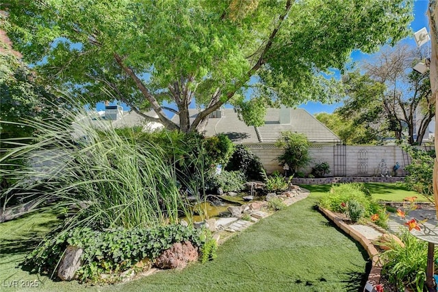 7109 Deepriver Cir, Las Vegas, NV 89129 - view of yard featuring a garden pond