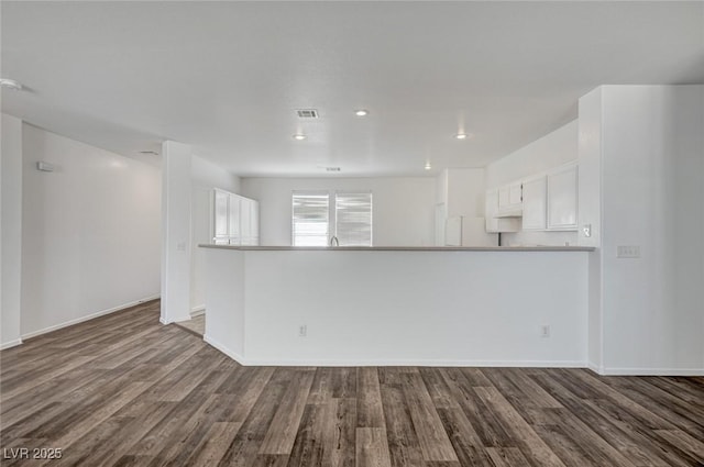 5622 Sage Pines Dr, Las Vegas, NV 89118 - unfurnished living room with dark wood-style floors, baseboards, and recessed lighting