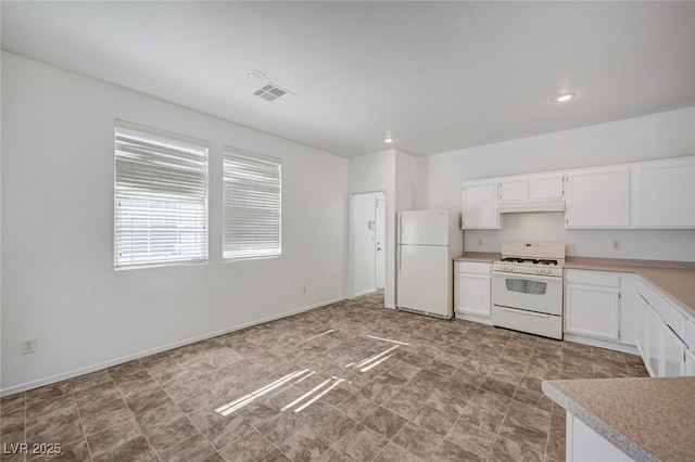 5622 Sage Pines Dr, Las Vegas, NV 89118 - kitchen with white appliances, light countertops, white cabinetry, under cabinet range hood, and recessed lighting