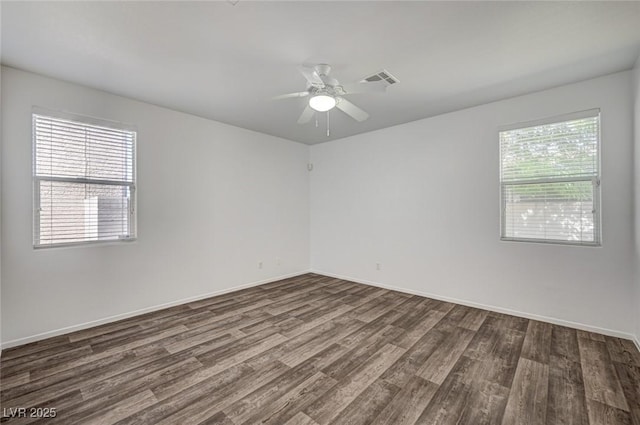 5622 Sage Pines Dr, Las Vegas, NV 89118 - unfurnished room featuring dark wood-style floors, baseboards, and a ceiling fan