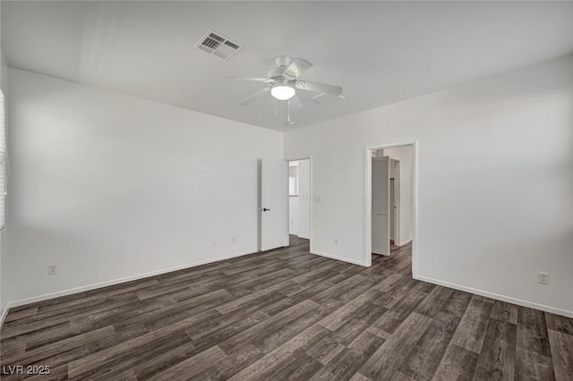 5622 Sage Pines Dr, Las Vegas, NV 89118 - spare room with dark wood-style floors, ceiling fan, and baseboards