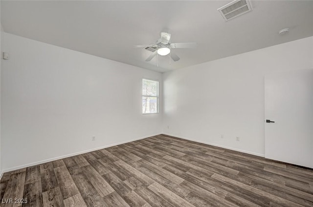 5622 Sage Pines Dr, Las Vegas, NV 89118 - unfurnished room featuring dark wood-type flooring, ceiling fan, a smoke detector, and baseboards