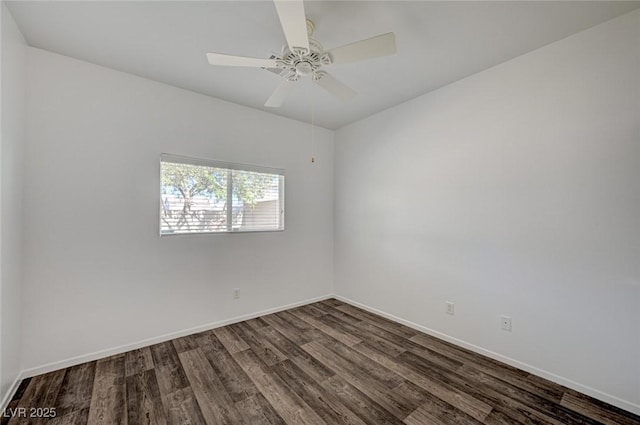 5622 Sage Pines Dr, Las Vegas, NV 89118 - empty room featuring dark wood-style floors, baseboards, and a ceiling fan