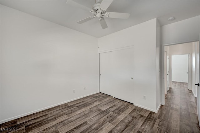 5622 Sage Pines Dr, Las Vegas, NV 89118 - unfurnished bedroom featuring wood finished floors, a closet, and baseboards