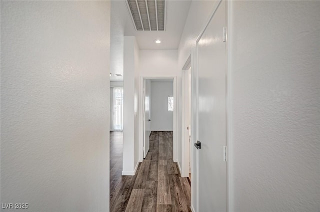 5622 Sage Pines Dr, Las Vegas, NV 89118 - corridor featuring dark wood-type flooring, a textured wall, and recessed lighting