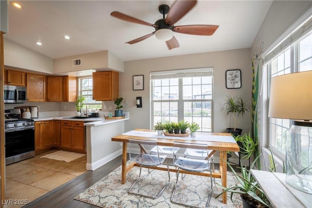 520 Arrowhead Trl Unit 1322, Henderson, NV 89015 - kitchen with appliances with stainless steel finishes, healthy amount of natural light, light countertops, a sink, and recessed lighting