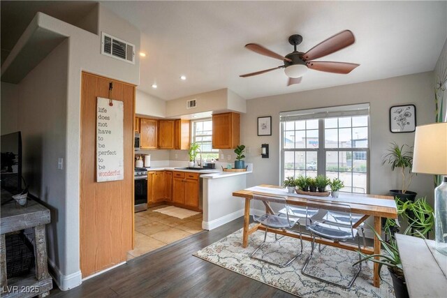 520 Arrowhead Trl Unit 1322, Henderson, NV 89015 - kitchen with a sink, light countertops, wood finished floors, a ceiling fan, and recessed lighting