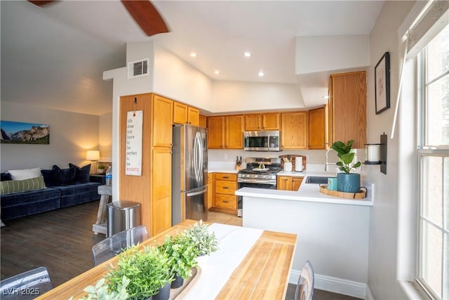 520 Arrowhead Trl Unit 1322, Henderson, NV 89015 - kitchen featuring stainless steel appliances, a sink, light countertops, brown cabinets, and open floor plan