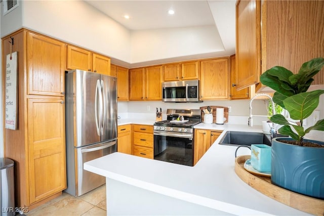 520 Arrowhead Trl Unit 1322, Henderson, NV 89015 - kitchen with stainless steel appliances, a sink, light countertops, light tile patterned floors, and recessed lighting