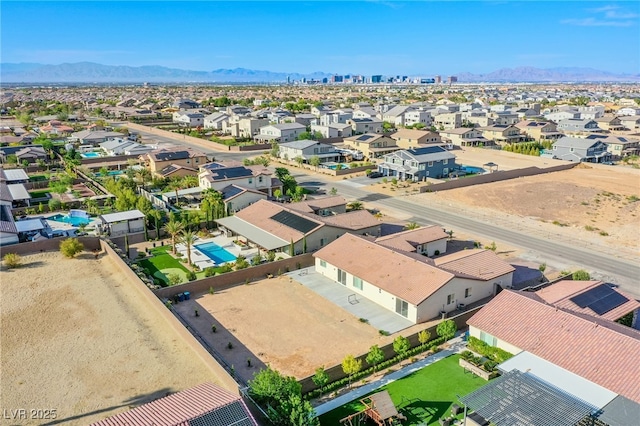 8665 Jerlyn St, Las Vegas, NV 89113 - aerial view of residential area featuring a mountain backdrop and a pool area